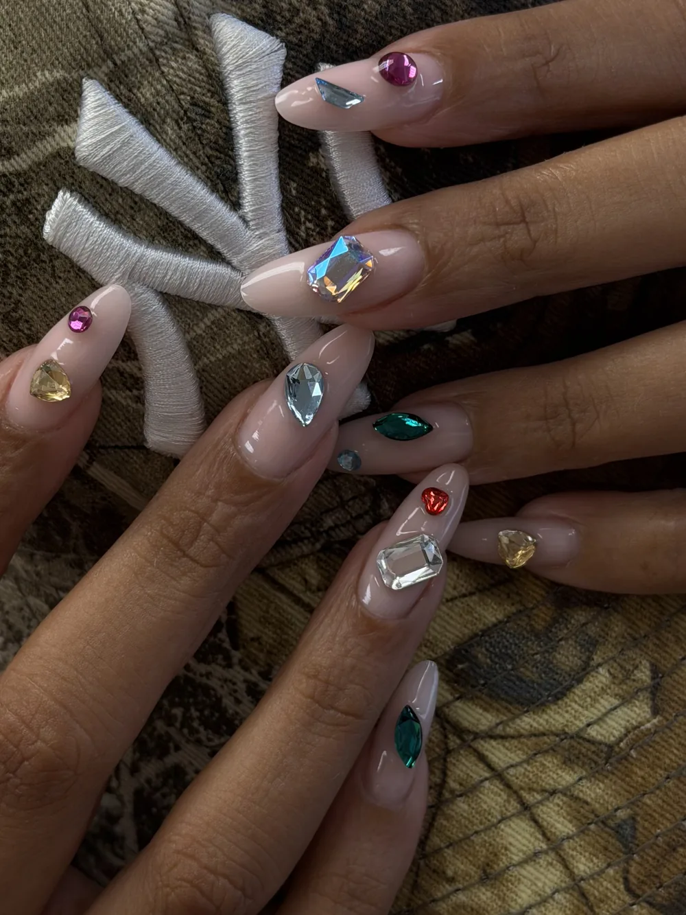 Long nails with crystal gems and multicoloured jewel accents