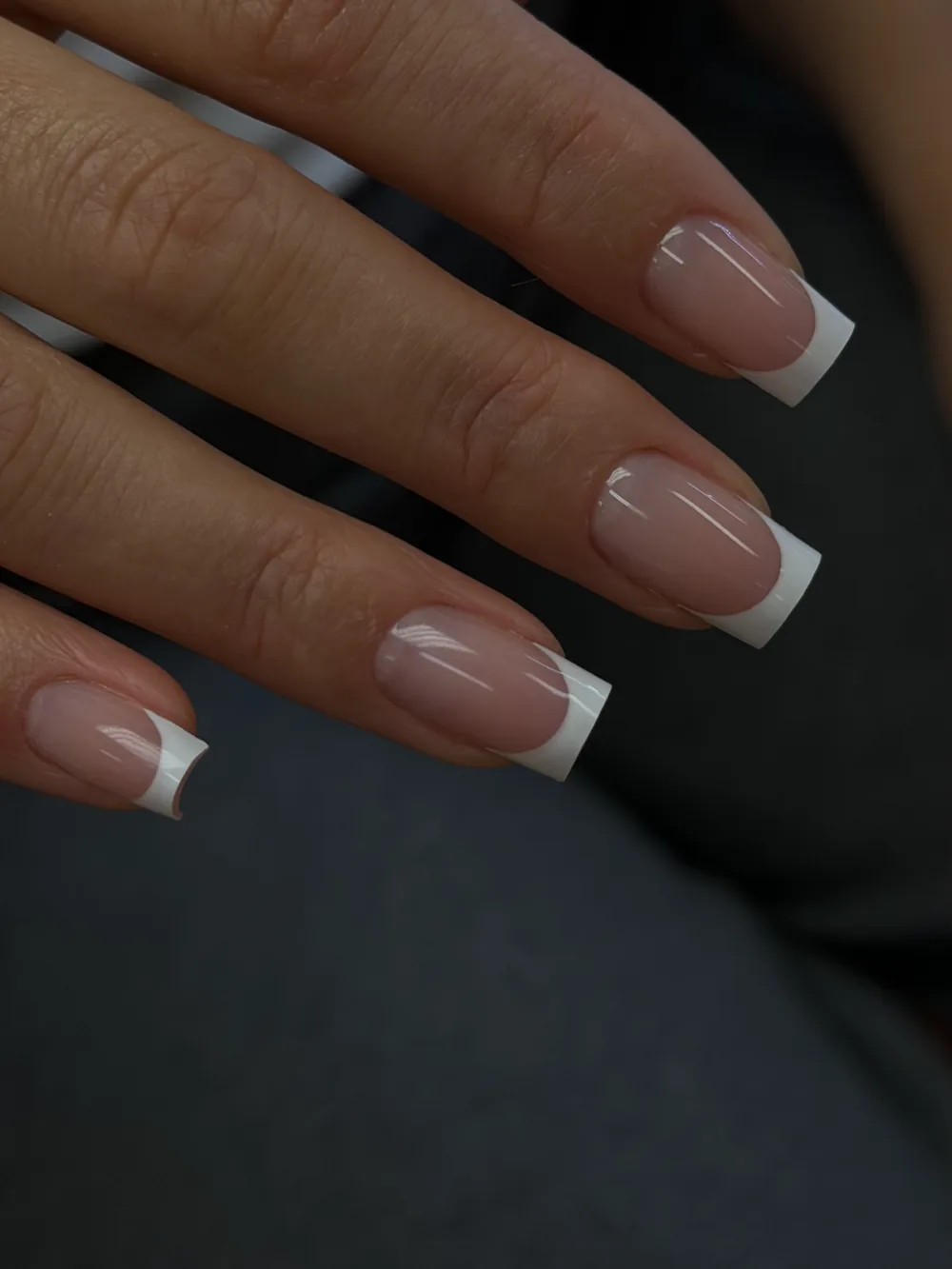 Clean white French tips on long square nails