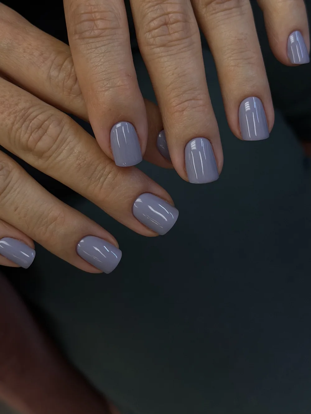 Lavender gel manicure on short rounded nails