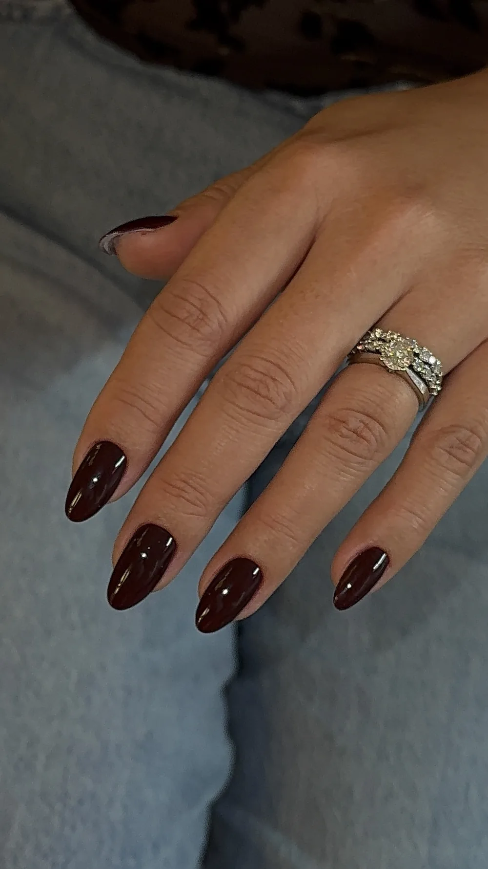 Glossy dark burgundy almond gel manicure
