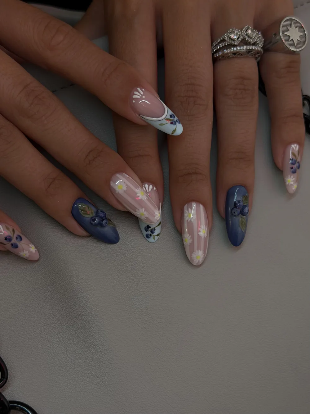 Navy and nude almond set with floral nail art