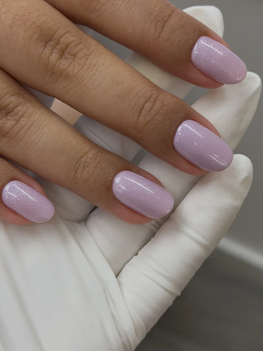 Soft pink chrome gel manicure on oval nails